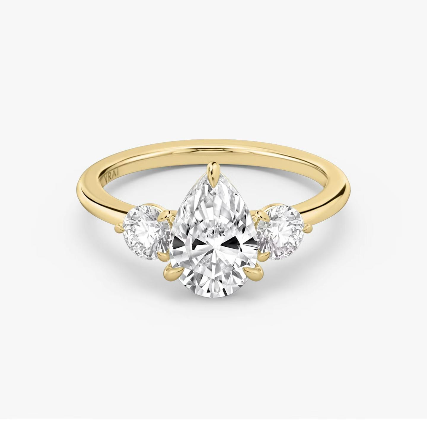 The Three Stone | Pear | 18k | 18k Yellow Gold | Band: Plain | Side stone carat: 1/4 | Side stone shape: Round Brilliant | Diamond orientation: vertical | Carat weight: See full inventory